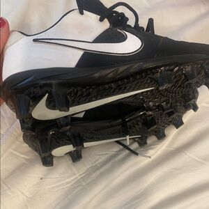 Nike Black and White Athletic cleats with Classic Design